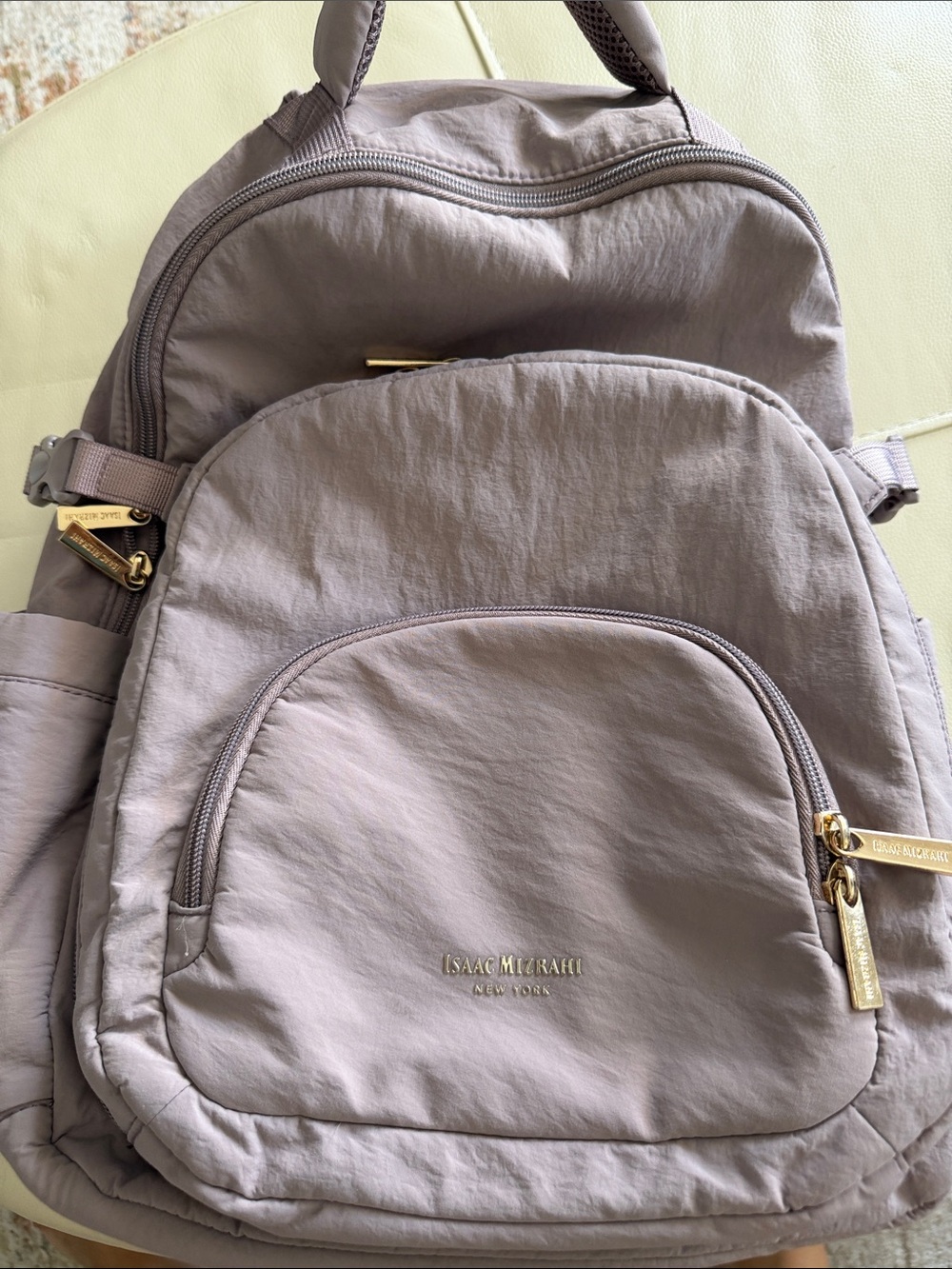 Isaac Mizrahi mauve-taupe nylon backpack with gold hardware